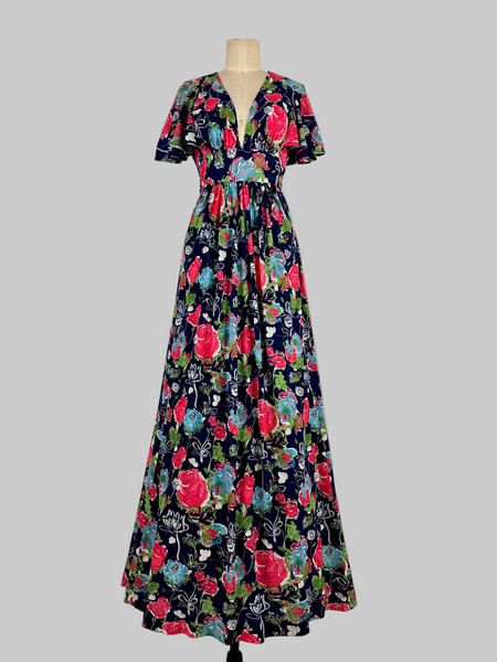 Vintage 1970s Jody T California floral print maxi dress featuring a vibrant, bohemian-inspired design with bold floral patterns, flowing silhouette, and retro charm