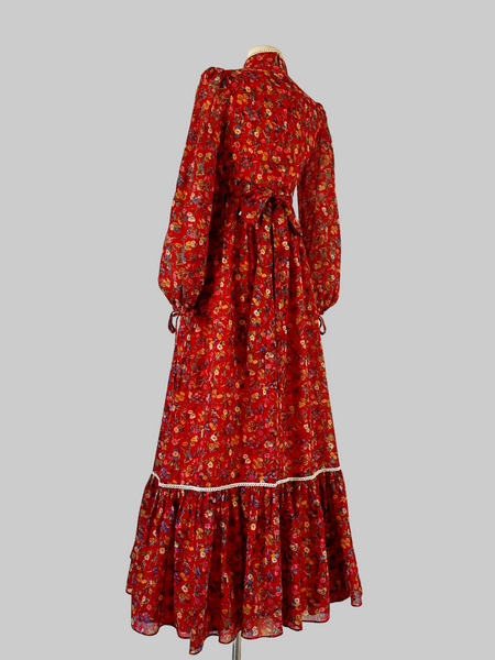 Vintage 1970s red Floral Maxi Bohemian Prairie Dress with lace up bodice and lace trim detailing. 
