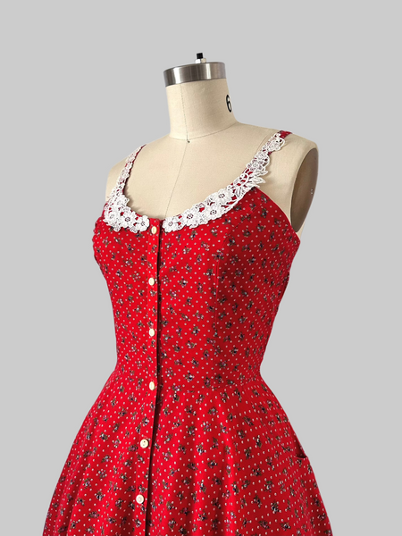 1970s Gunne Sax cherry red prairie dress with lace trim, button front, and full skirt.