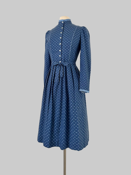 Vintage 1980s Lanz Originals cotton mid-length dress in soft blue with an allover floral print, featuring long sleeves and a belted waist