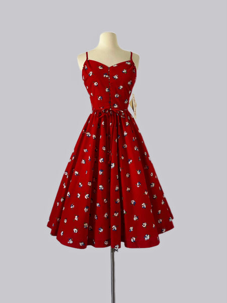 1980s Lanz Originals red Tyrolean floral cotton dress with crisscross back, tie detail, full skirt, and hidden pockets — NOS condition