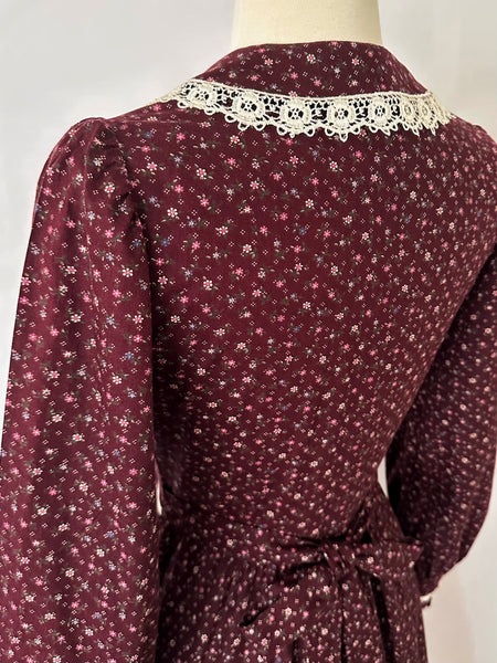 1970s Burgundy vintage Gunne Sax dress with a floral print and a white lace-trimmed collar.