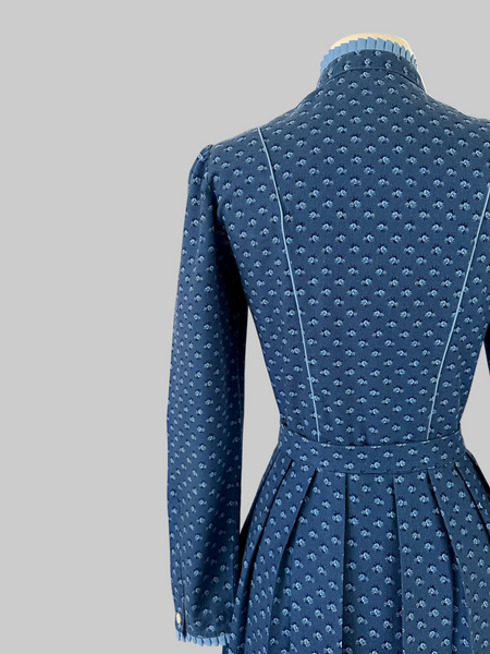 Vintage 1980s Lanz Originals cotton mid-length dress in soft blue with an allover floral print, featuring long sleeves and a belted waist