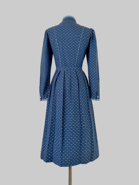 Vintage 1980s Lanz Originals cotton mid-length dress in soft blue with an allover floral print, featuring long sleeves and a belted waist