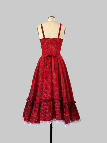 1970s Gunne Sax cherry red prairie dress with lace trim, button front, and full skirt.