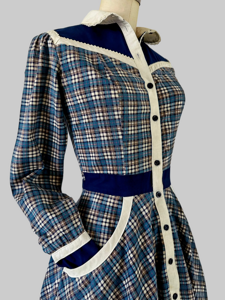 Vintage 1970s  Gunne Sax blue plaid Western-style dress with button-front bodice, cream placket, navy yoke, ric-rac trim, curved pockets, and full skirt
