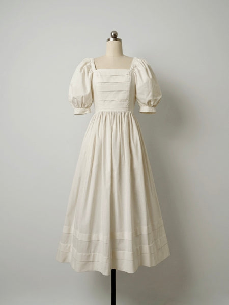1980s Laura Ashley antique white cotton midi dress with pintucked bodice, puff sleeves, square neckline and full skirt, made in Great Britain