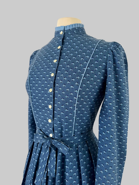 Vintage 1980s Lanz Originals cotton mid-length dress in soft blue with an allover floral print, featuring long sleeves and a belted waist