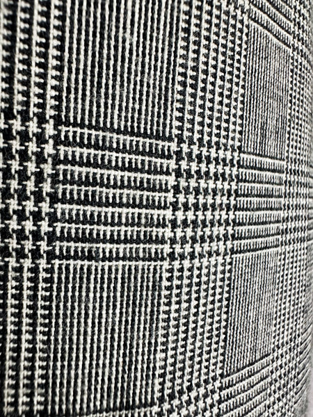 Close-up of a textured fabric with a checkered pattern