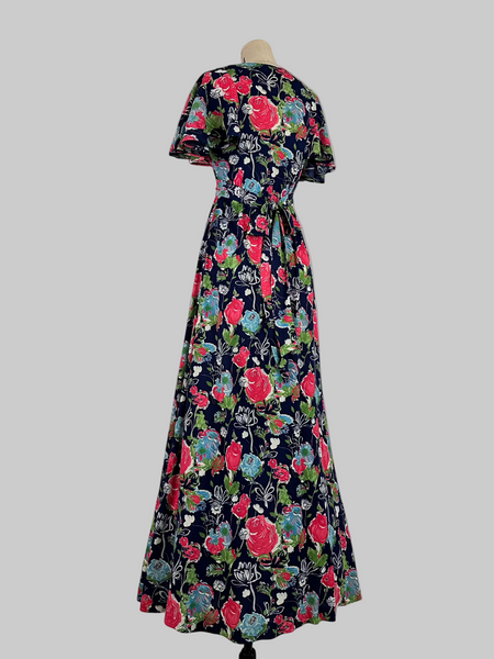 Vintage 1970s Jody T California floral print maxi dress featuring a vibrant, bohemian-inspired design with bold floral patterns, flowing silhouette, and retro charm