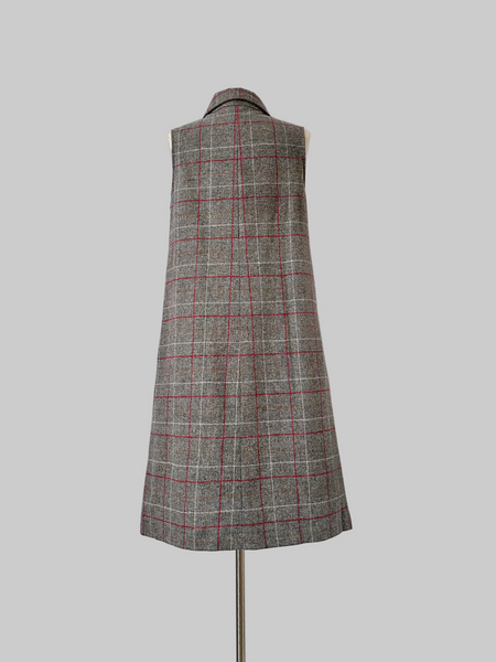 Vintage 1960s sleeveless J. Tiktiner dress made in Nice, France, featuring a gray wool A-line silhouette with red and cream windowpane check, pointed collar, full-length button front, and side seam pockets.
