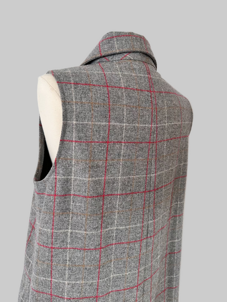 Vintage 1960s sleeveless J. Tiktiner dress made in Nice, France, featuring a gray wool A-line silhouette with red and cream windowpane check, pointed collar, full-length button front, and side seam pockets.