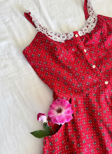 1970s Gunne Sax cherry red prairie dress with lace trim, button front, and full skirt.