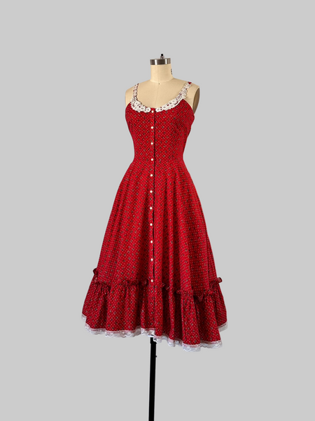 1970s Gunne Sax cherry red prairie dress with lace trim, button front, and full skirt.