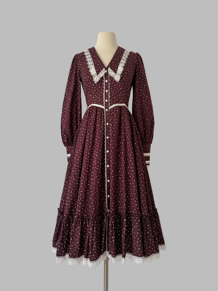 1970s Burgundy vintage Gunne Sax dress with a floral print and a white lace-trimmed collar.