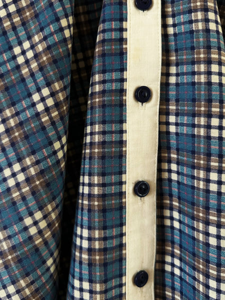 Detail of vintage 1970s Gunne Sax blue plaid dress showing d button-front.